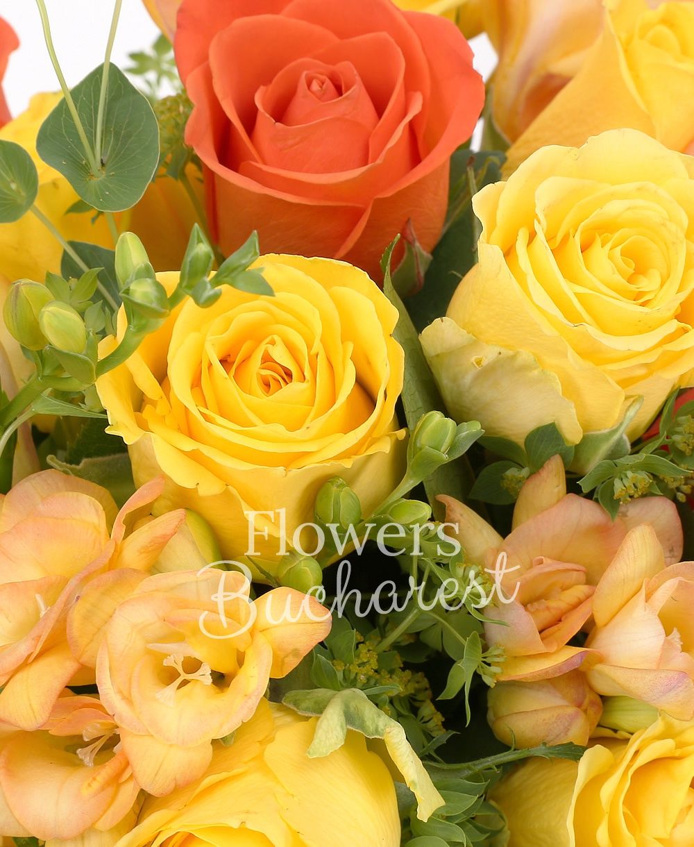 10 yellow roses, 7 orange roses, 10 yellow freesias, greenery