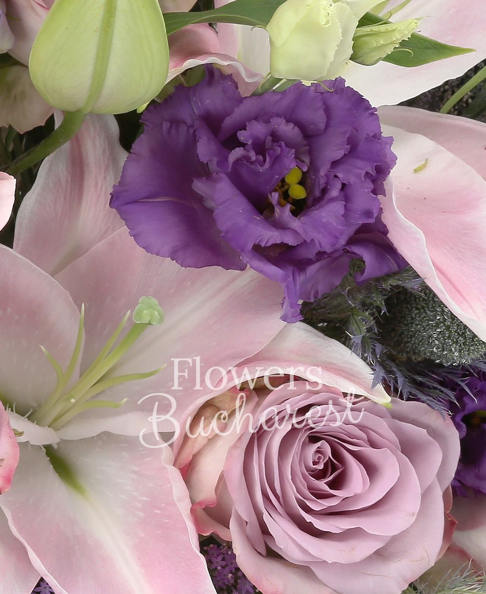 10 purple roses, 3 pink lilies, 5 purple lisianthus, 3 purple trachelium, 3 eryngium, 5 pink carnations