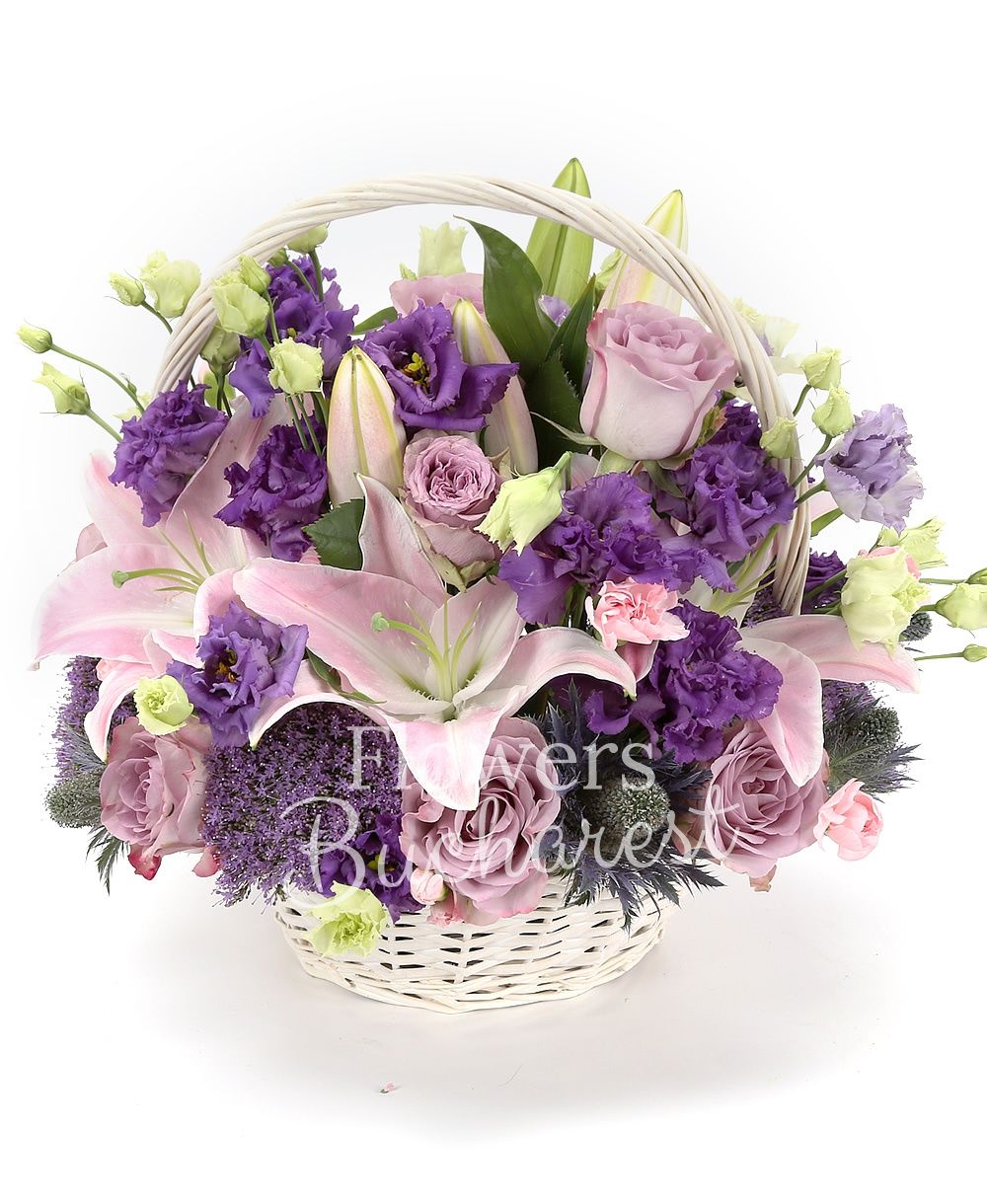 10 purple roses, 3 pink lilies, 5 purple lisianthus, 3 purple trachelium, 3 eryngium, 5 pink carnations