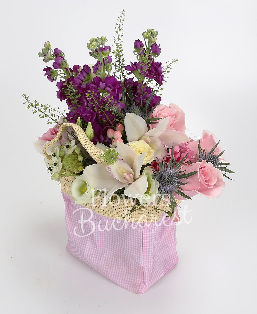 3 pink roses, 3 purple mathiolla, white cymbidium, 2 white ornithogalum, 2 pink carnations, eryngium, 2 pink hypericum, 2 pink bouvardia, white lisianthus