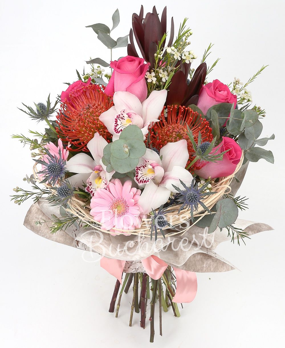 5 cyclam roses, 2 leucadendron, 2 leucospermum, white cymbidium, 2 pink gerbera, 2 eryngium, white waxflower, greenery