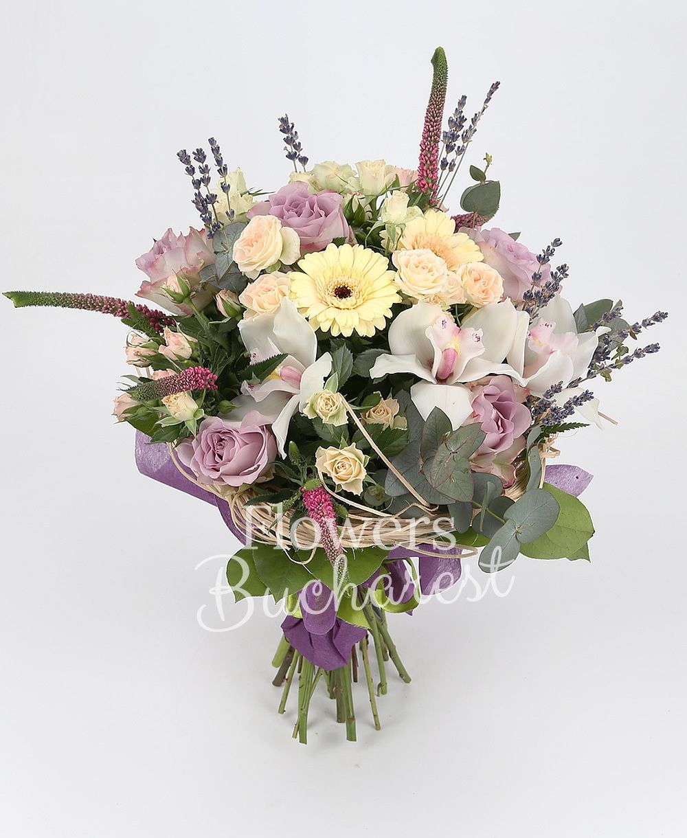 5 purple roses, 5 pink miniroses, 3 cream gerbera, 5 pink veronica, white cymbidium, lavender, greenery