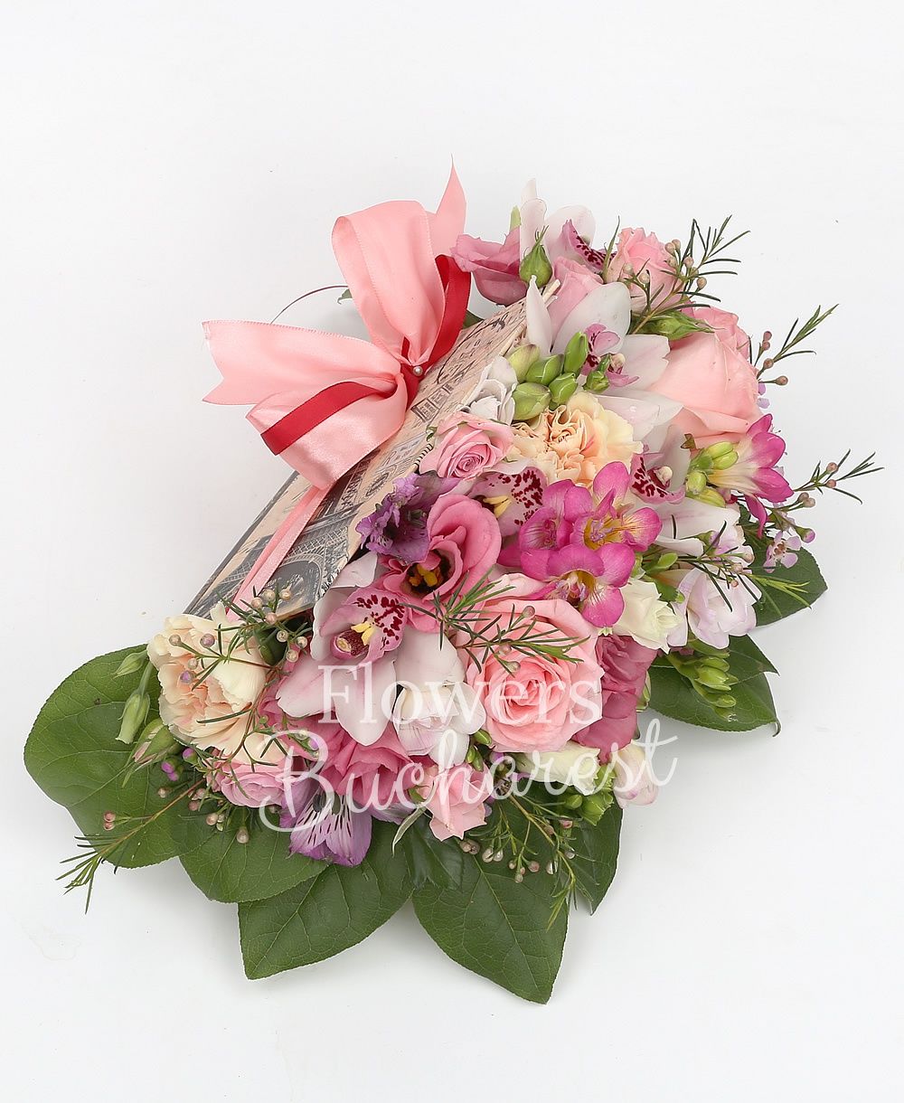 3 pink roses, 3 pink miniroses, 3 cream carnations, 5 cyclam freesias, 2 mauve alstroemeria, white cymbidium, 2 pink lisianthus, pink waxflower, greenery