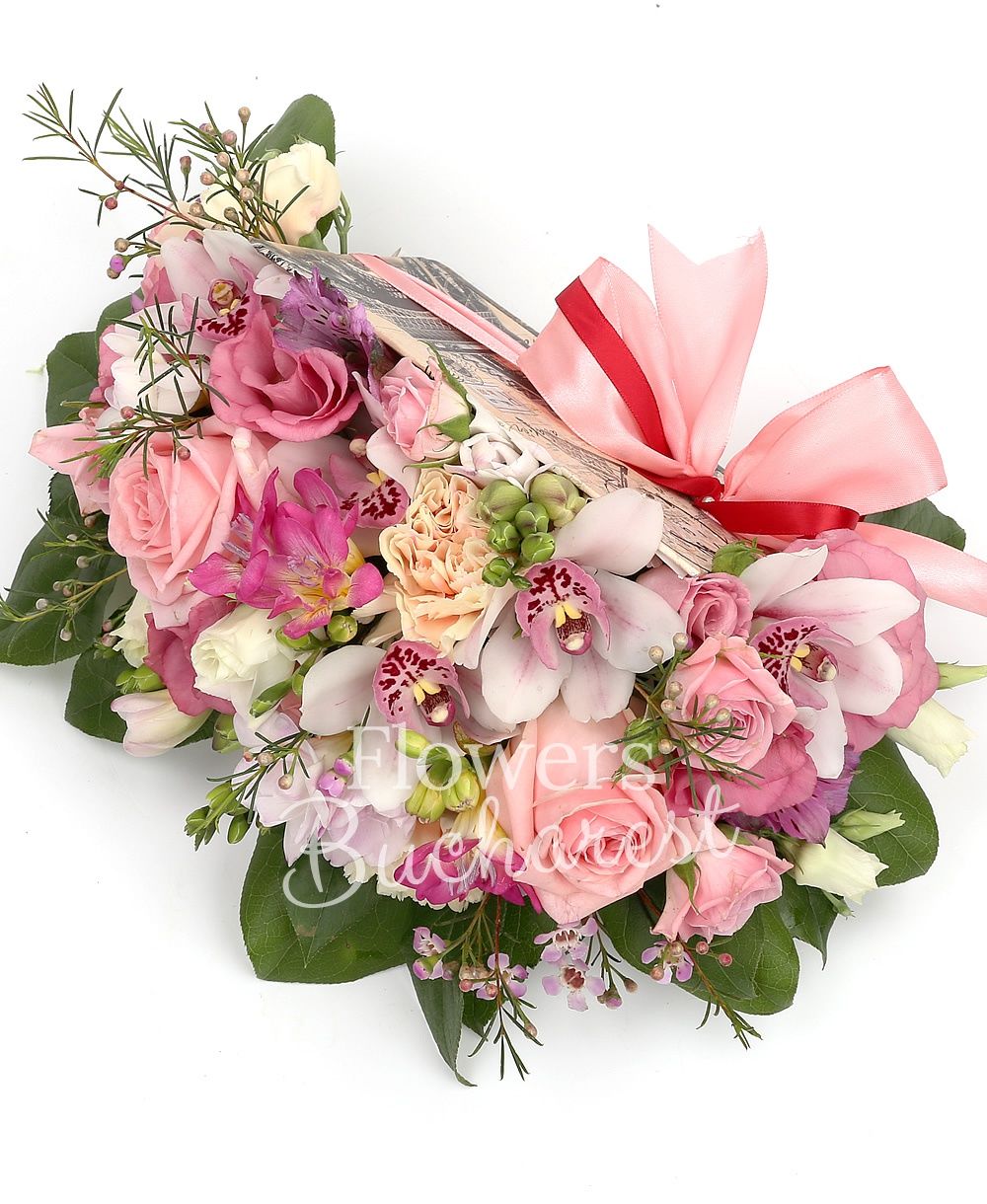 3 pink roses, 3 pink miniroses, 3 cream carnations, 5 cyclam freesias, 2 mauve alstroemeria, white cymbidium, 2 pink lisianthus, pink waxflower, greenery