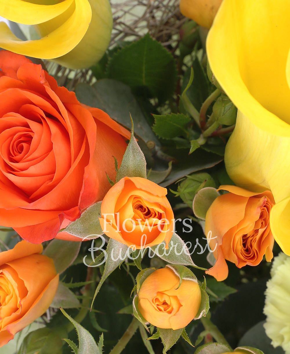3 orange roses, 3 yellow cala, 3 orange miniroses, 3 green carnations, greenery