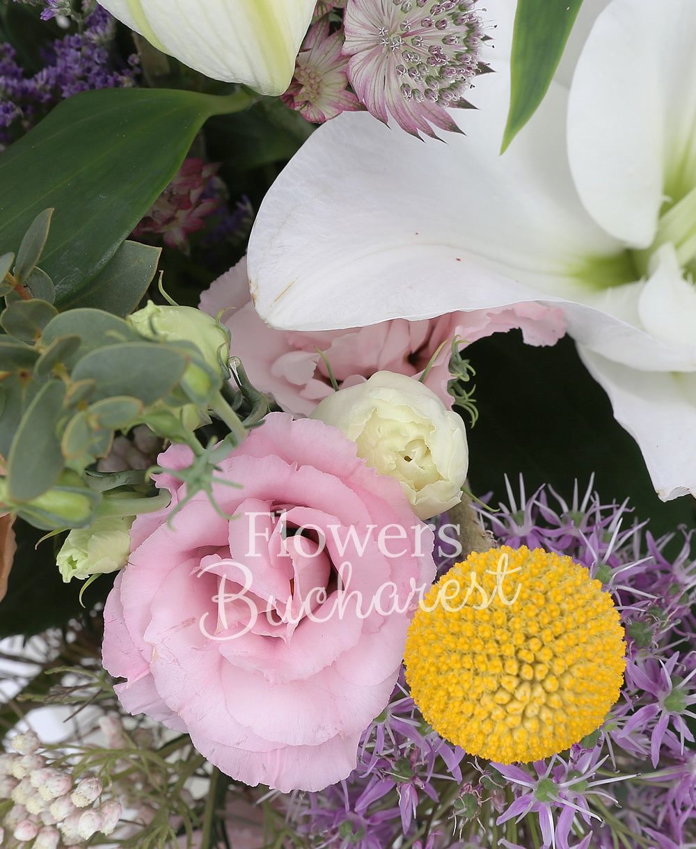 1 white imperial lily, 5 cappuccino roses, 3 cream carnations, 3 pink lisianthus, 3 rice flower, red astranția, 3 allium, greenery