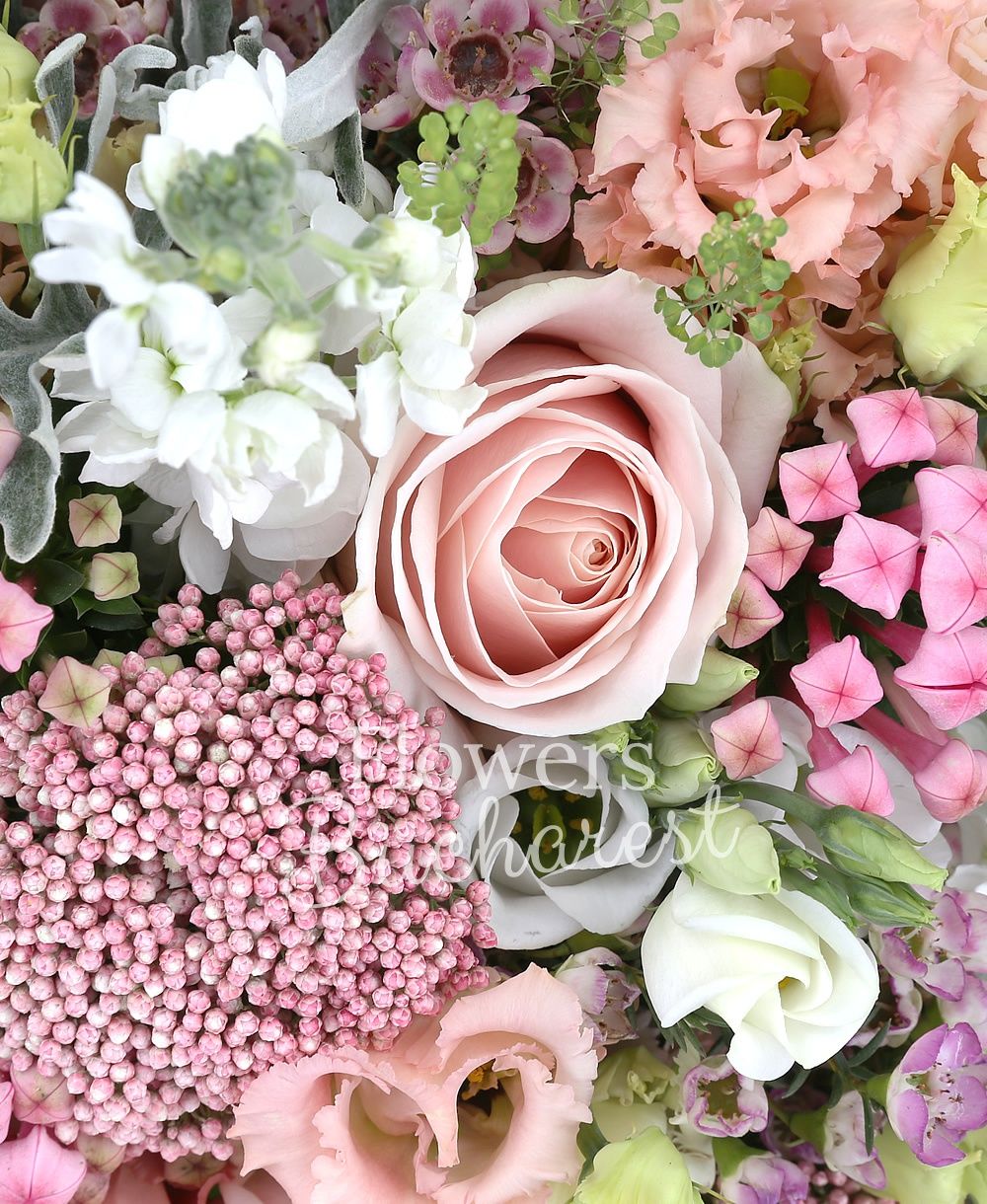 10 pink roses, 10 white matthiola, 5 pink lisianthus, 10 pink bouvardia, 5 rice flower, 5 white lisianthus, 3 agapanthus, greenery