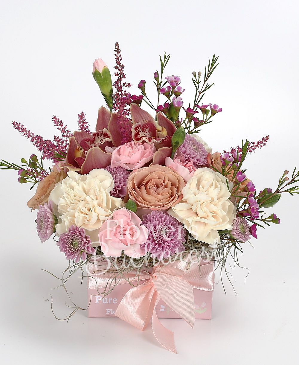 3 cappuccino roses, 3 cream carnations, 3 pink carnations, 3 purple santini, 1 pink waxflower, 3 red astilbe, garnet cymbidium, greenery