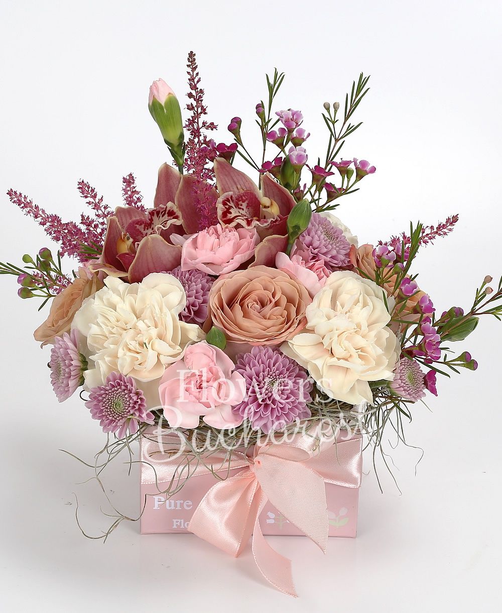 3 cappuccino roses, 3 cream carnations, 3 pink carnations, 3 purple santini, 1 pink waxflower, 3 red astilbe, garnet cymbidium, greenery