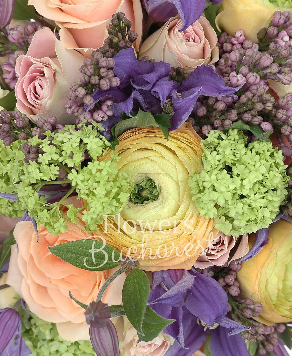 10 orange roses, 5 mauve clematis, 5 mauve lilac, 5 green viburnum, 7 orange ranunculus, greenery