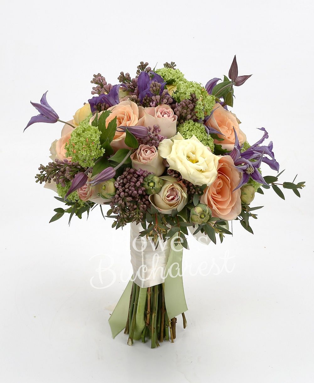 10 orange roses, 5 mauve clematis, 5 mauve lilac, 5 green viburnum, 7 orange ranunculus, greenery