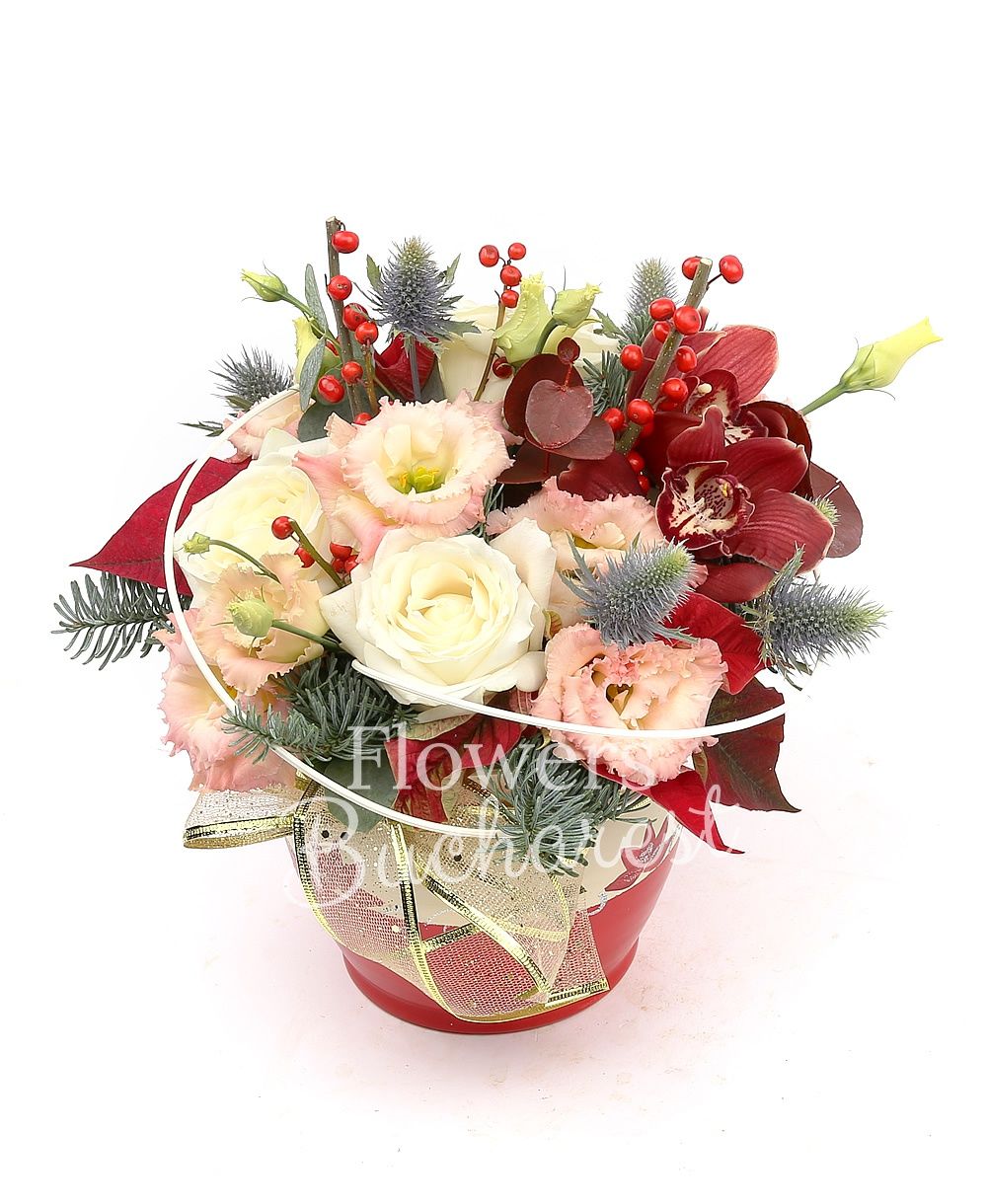 3 white roses, 1 garnet cymbidium, 3 pink lisianthus, ilex, eryngium, poinsettia, greenery