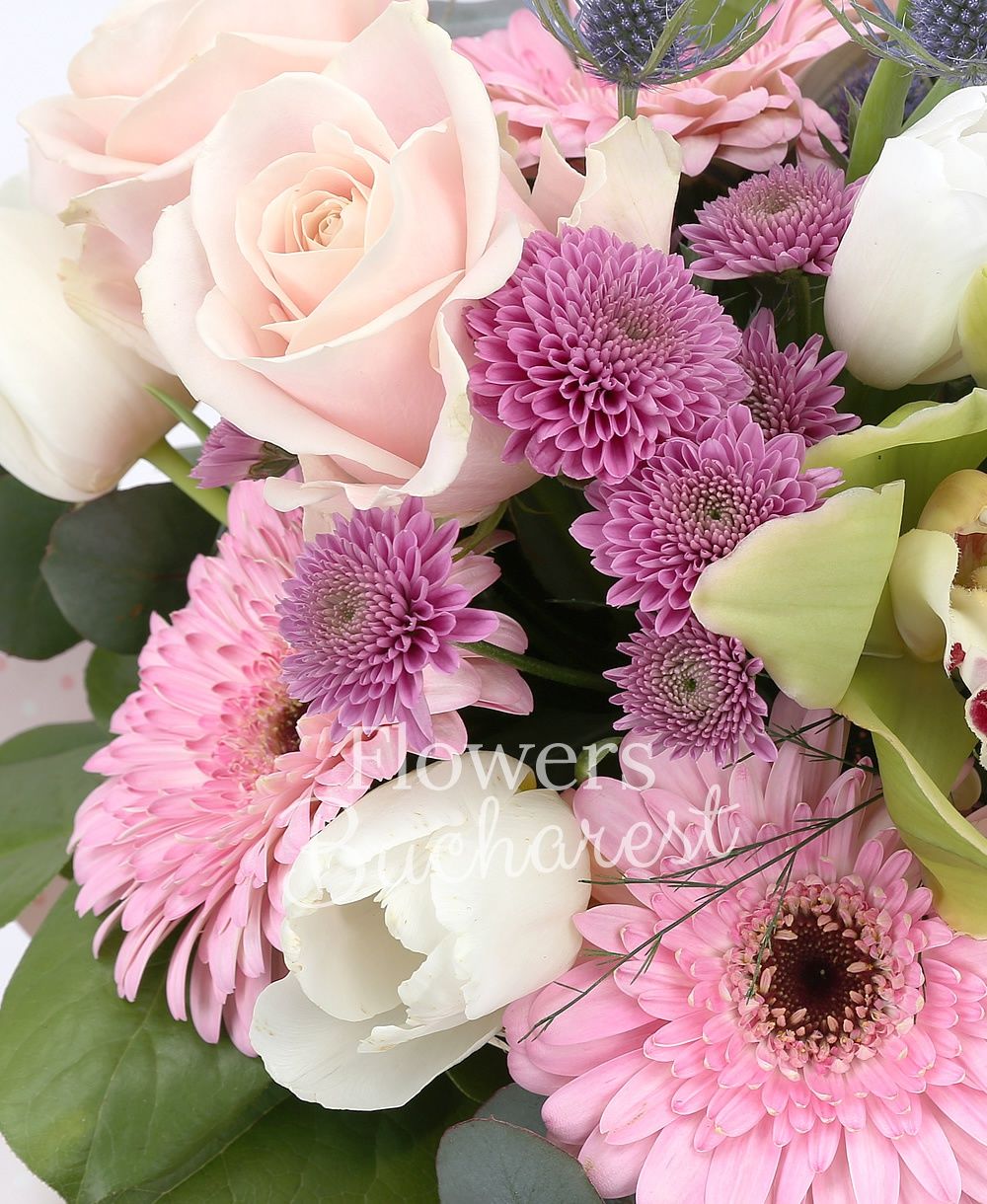 3 pink roses, 2 pink gerbera, 5 white tulips, 2 pink santini, 2 eryngium, green cymbidium, greenery