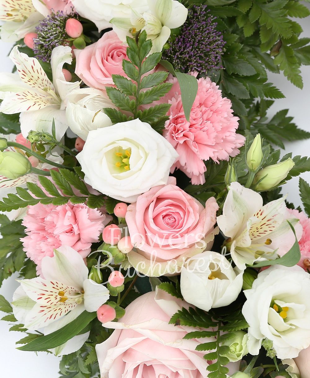10 pink roses, 15 pink carnations, 5 white alstroemeria, 10 white lisianthus, 10 pink hypericum, 10 white tulips, 10 mauve trachelium, greenery