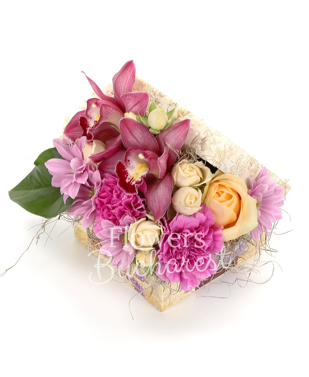 2 pink cymbidium, 2 peach avalanche roses, 2 miniroses, 3 carnations, 1 pink chrysanthemum, greenery