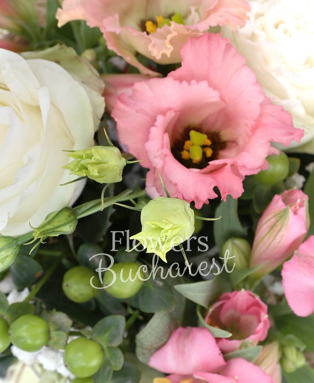 3 white roses, 2 pink alstroemerias, 2 pink lisianthus, 2 green hypericum, greenery