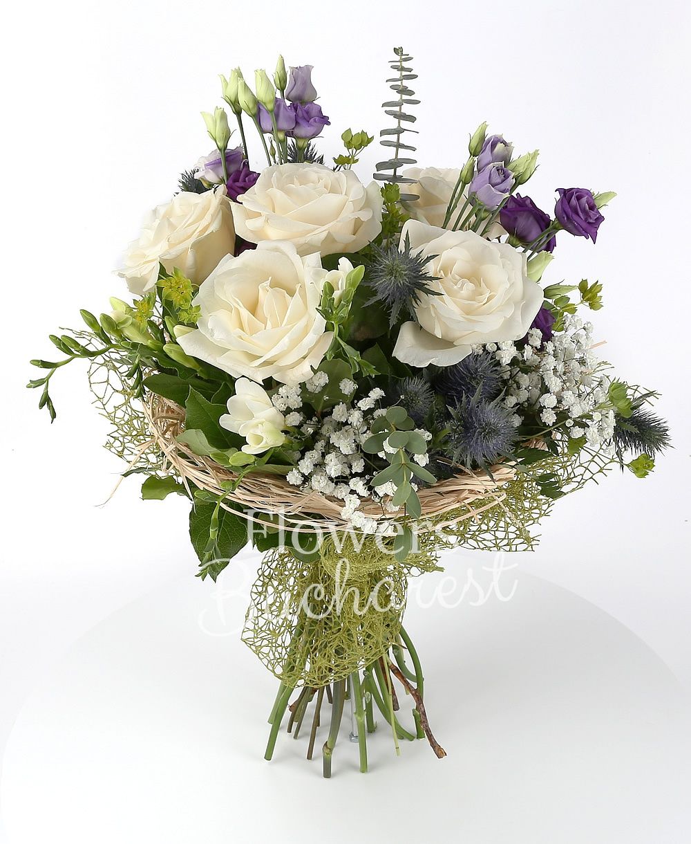 5 white roses, 3 purple lisianthus, 3 eryngium, 7 white freesias, greenery