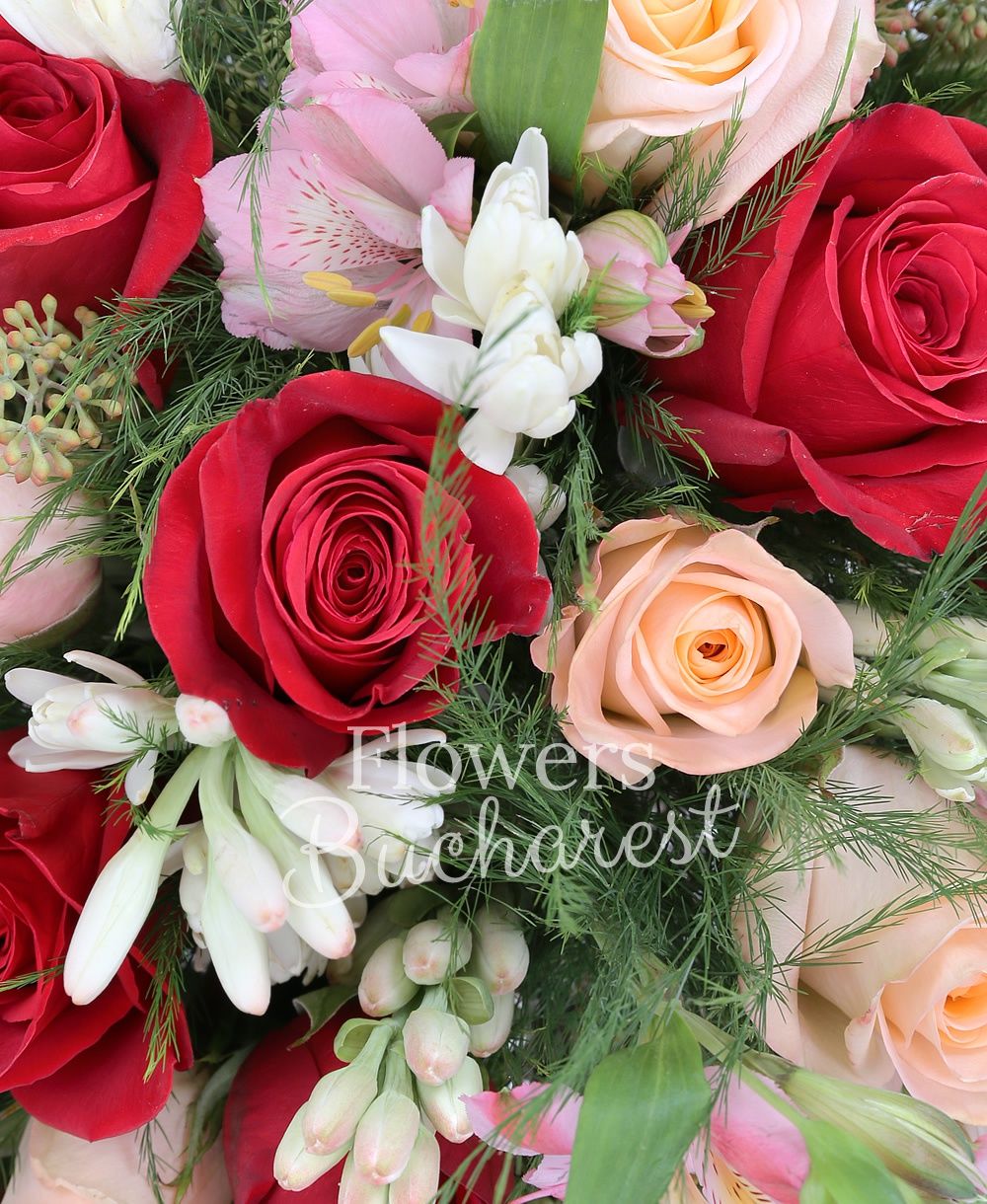 11 cream roses, 12 red roses, 5 pink alstroemeria, 5 white alstroemeria, greenery