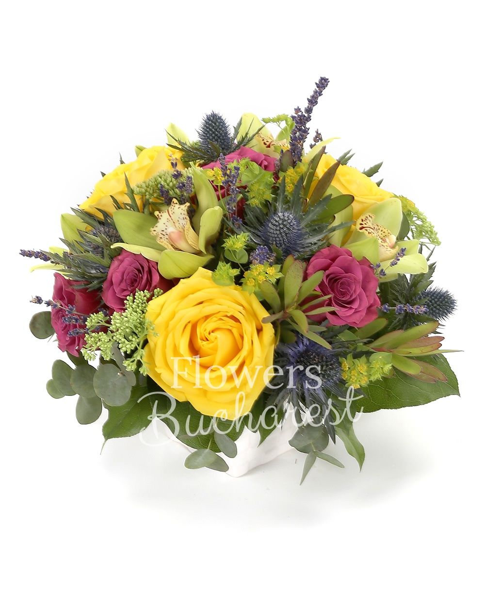 3 yellow roses, 5 purple roses, green cymbidium, 2 eryngium, 3 sedum, 3 leucadendron, greenery