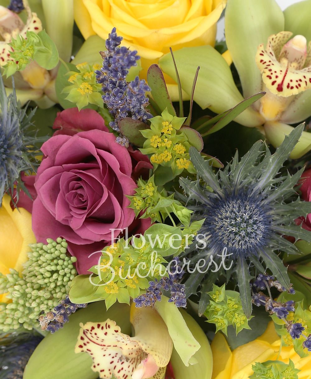 3 yellow roses, 5 purple roses, green cymbidium, 2 eryngium, 3 sedum, 3 leucadendron, greenery