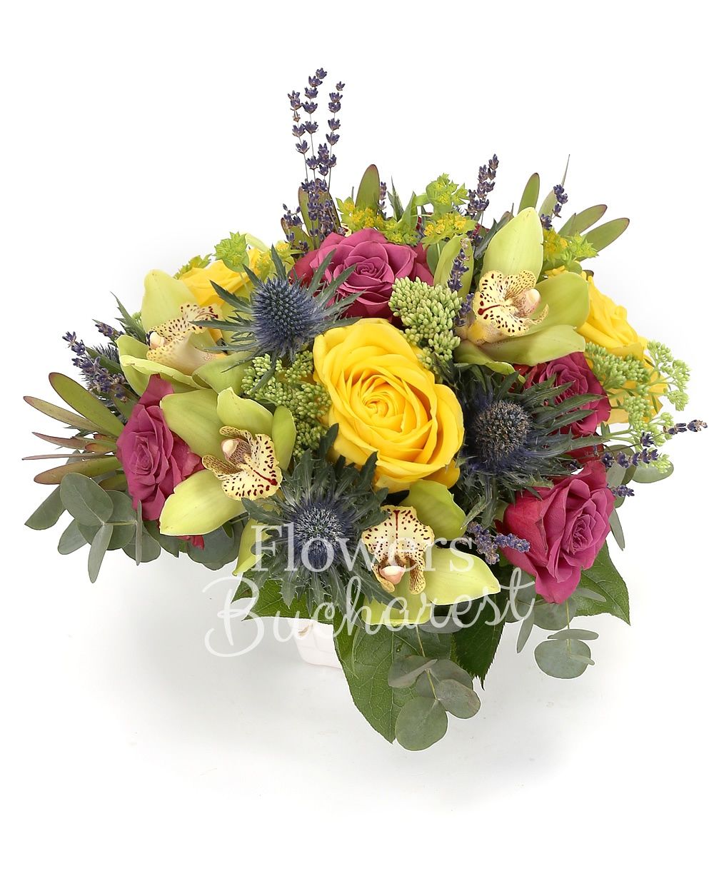 3 yellow roses, 5 purple roses, green cymbidium, 2 eryngium, 3 sedum, 3 leucadendron, greenery