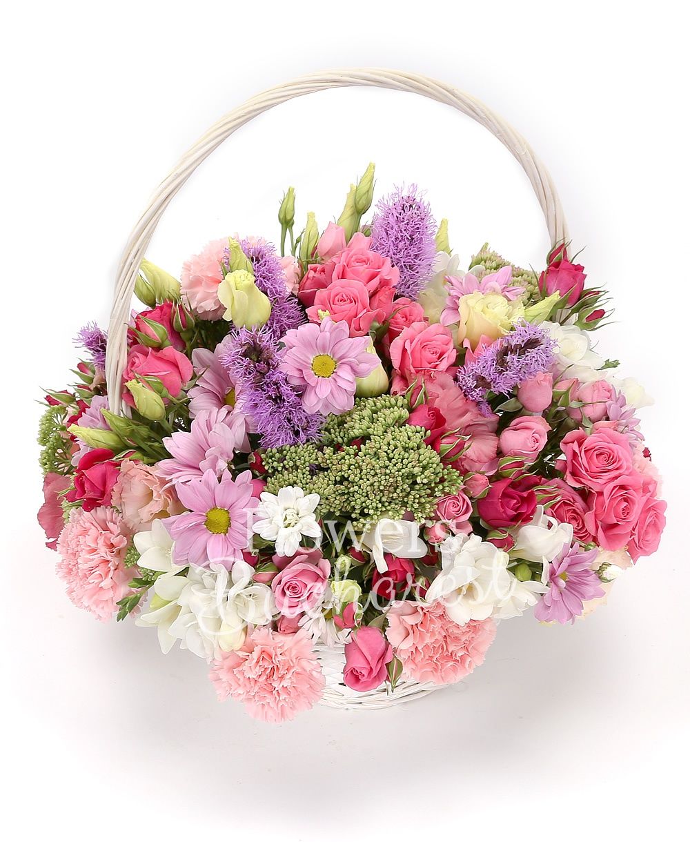 10 pink miniroses, 5 mauve liatris, 7 pink carnations, 3 sedum, 2 chrysanthemums, 10 white freesias, 3 pink lisianthus, basket