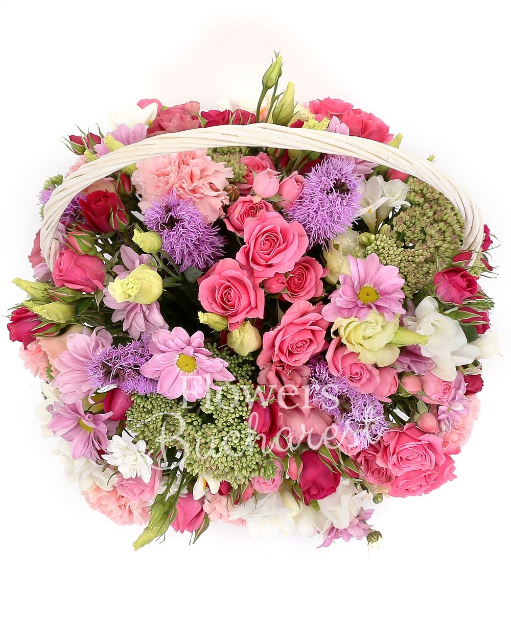 10 pink miniroses, 5 mauve liatris, 7 pink carnations, 3 sedum, 2 chrysanthemums, 10 white freesias, 3 pink lisianthus, basket
