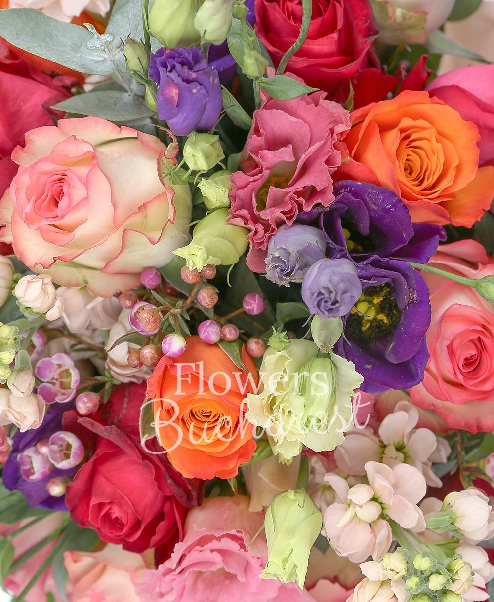 10 pink roses, 5 cyclam roses, 3 orange roses, 7 cream mathiolla, 7 mauve lisianthus, greenery