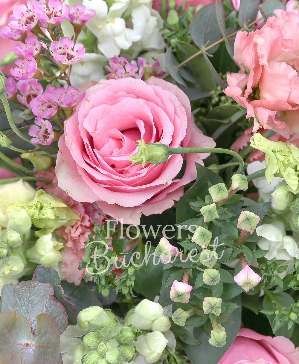 11 pink roses, 5 antirrhinum, 7 pink bouvardia, 5 pink lisianthus, waxflower, greenery