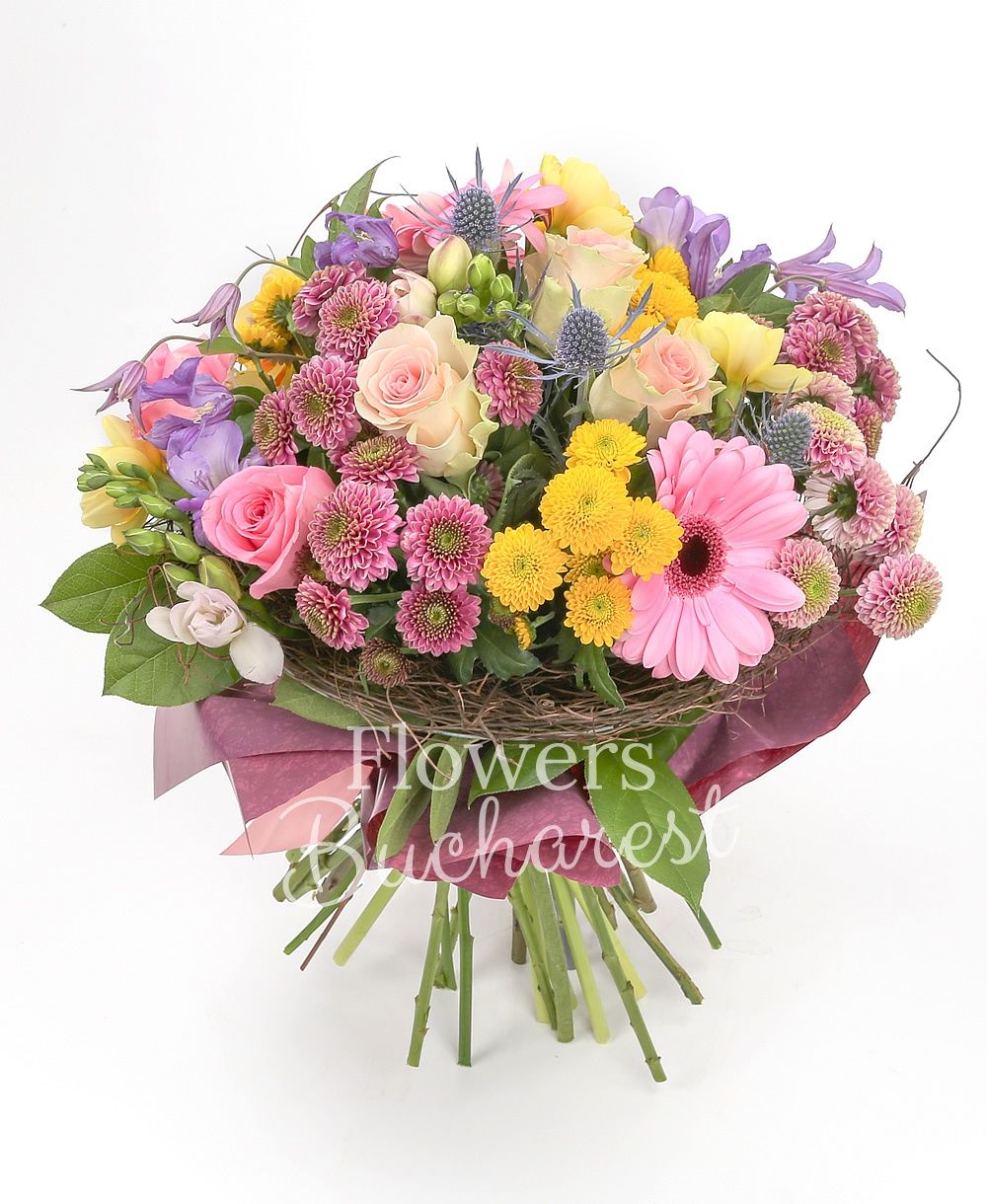 5 pink roses, 5 mauve santini, 5 yellow santini, 3 pink gerbera, 2 eryngium, 5 mauve freesias, 10 yellow daffodils, 3 mauve clematis, greenery