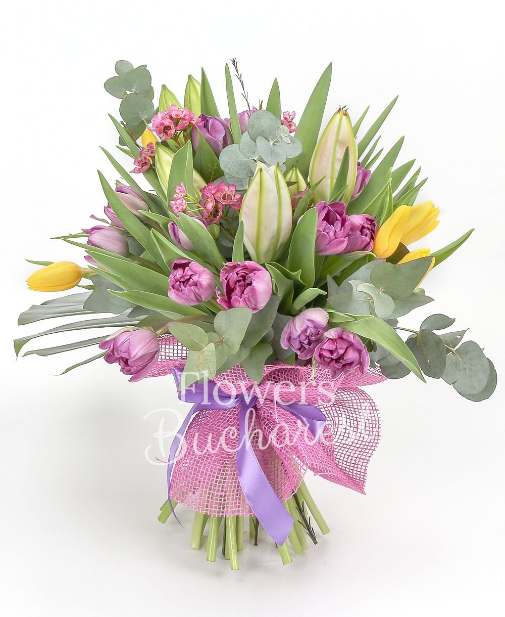 2 imperial pink lilies, 10 yellow tulips, 15 purple tulips, 2 pink waxflowers, greenery