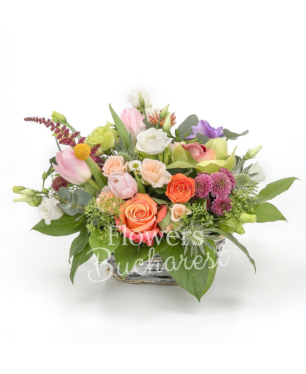 3 pink tulips, 2 green lisianthus, 2 white lisianthus, 2 pink miniroses, 2 green cymbidium, 1 eryngium, 2 orange roses, 3 purple freesias, 2 red astilbe, 2 purple santini, basket