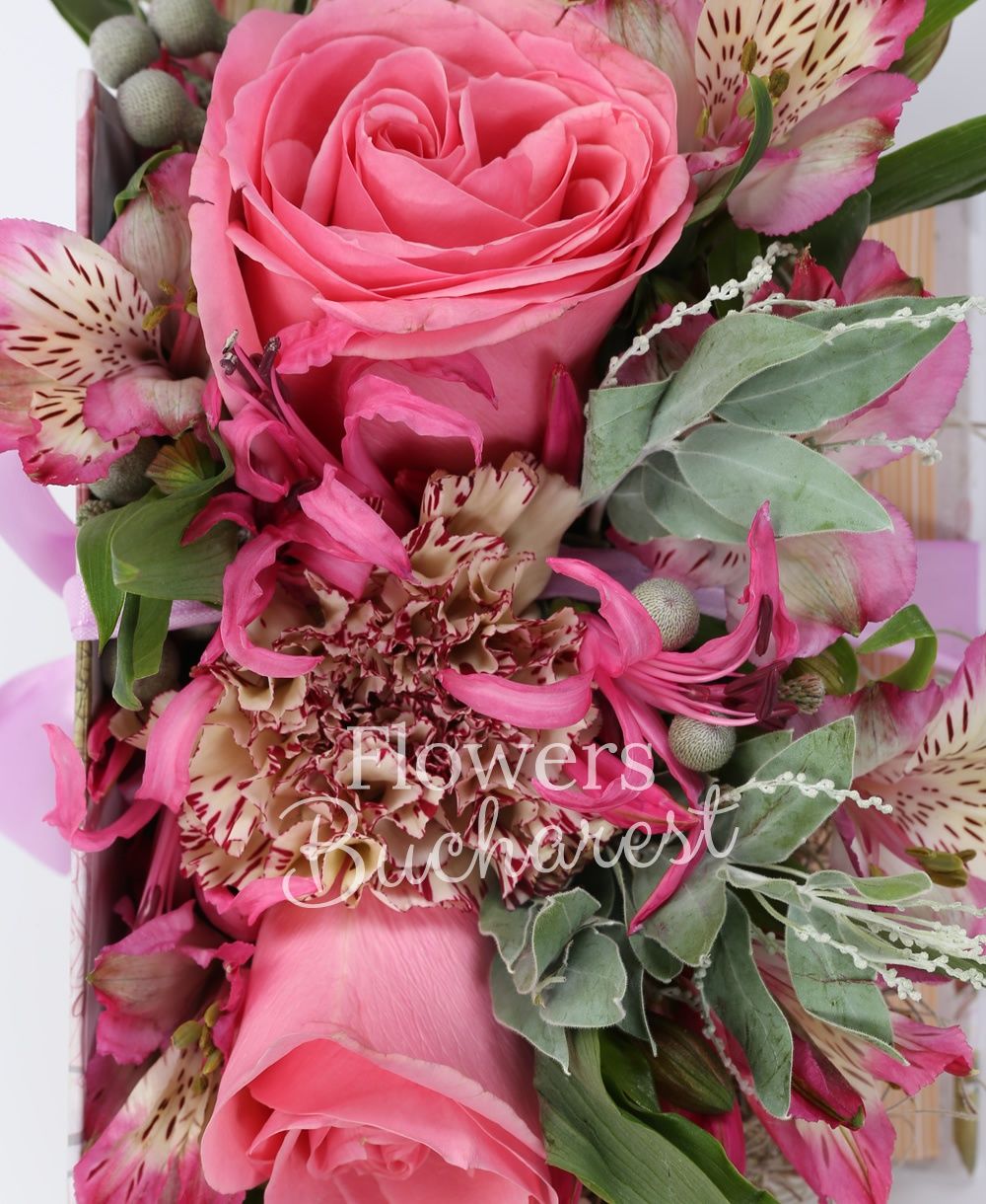 2 pink roses, 3 carnations, 2 pink nerines, 2 pink alstroemeria, brunia, acacia