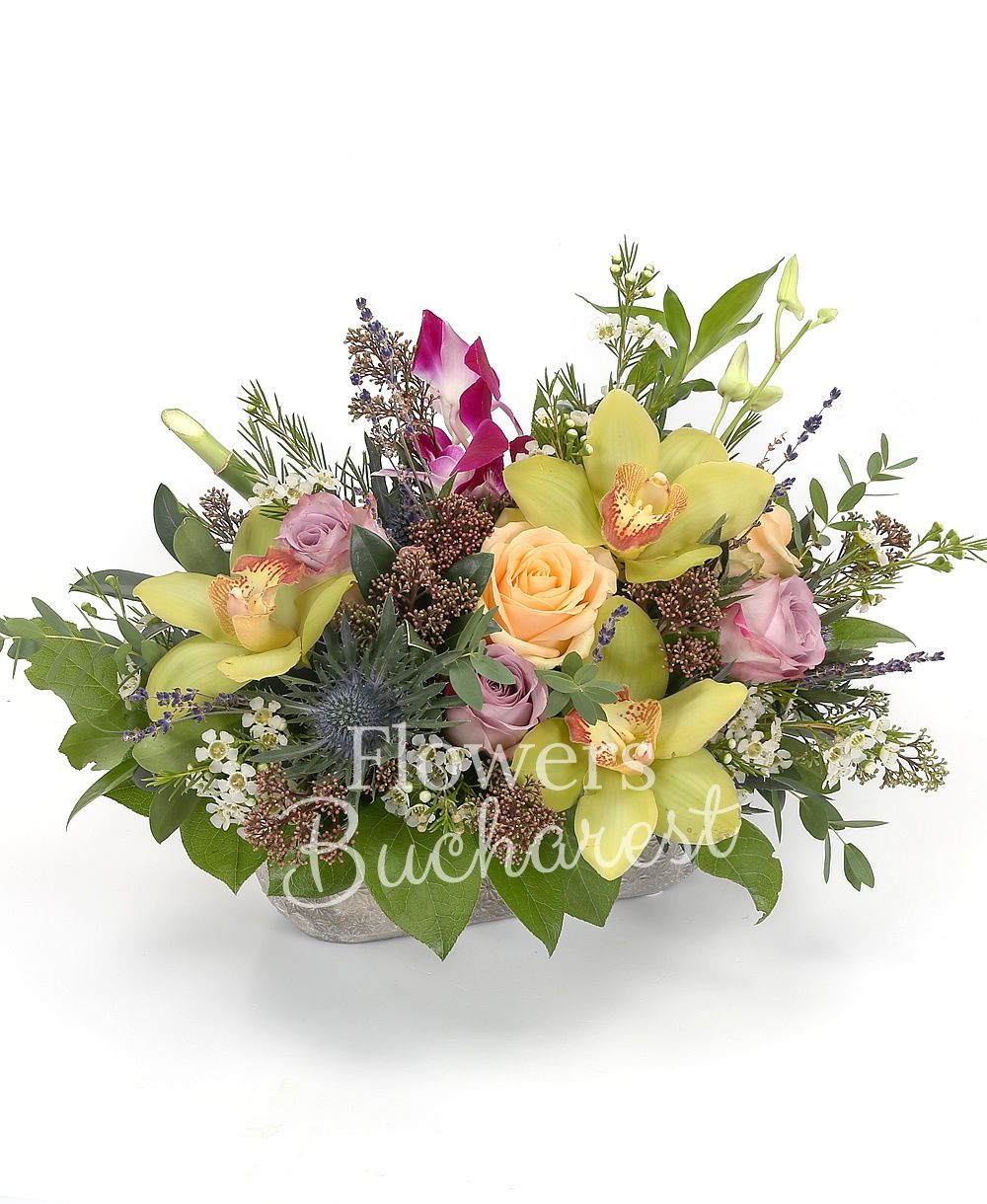 3 mauve roses, 3 cream roses, 2 dendrobium orchids, 1 eryngium, green cymbidium, greenery