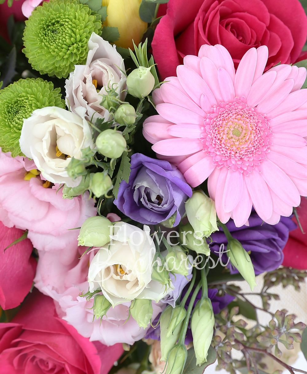 5 cyclam roses, 3 pink lisianthus, 3 mauve lisianthus, 5 yellow tulips, 2 eryngium, 3 cream gerbera, 2 pink gerbera, 3 cream miniroses, greenery