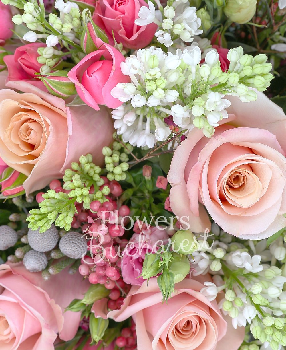 10 pink roses, 5 pink miniroses, 5 pink bouvardia, 5 brunia, 7 white lilac, 5 waxflower, greenery