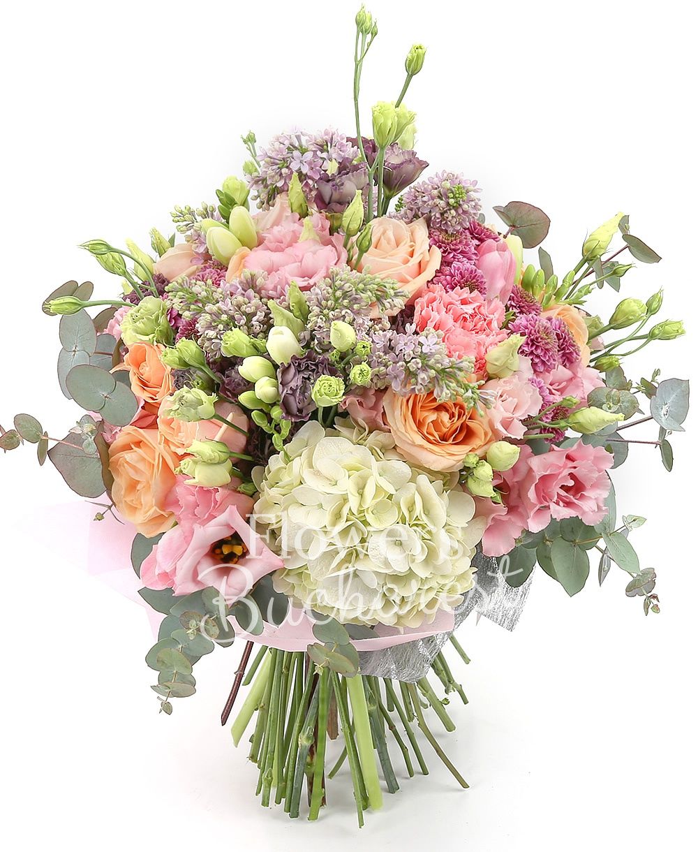 5 mauve lilac, 10 peach roses, 5 mauve lisianthus, 3 pink lisianthus, 5 pink carnations, 3 pink santini, 1 white hydrangea, greenery