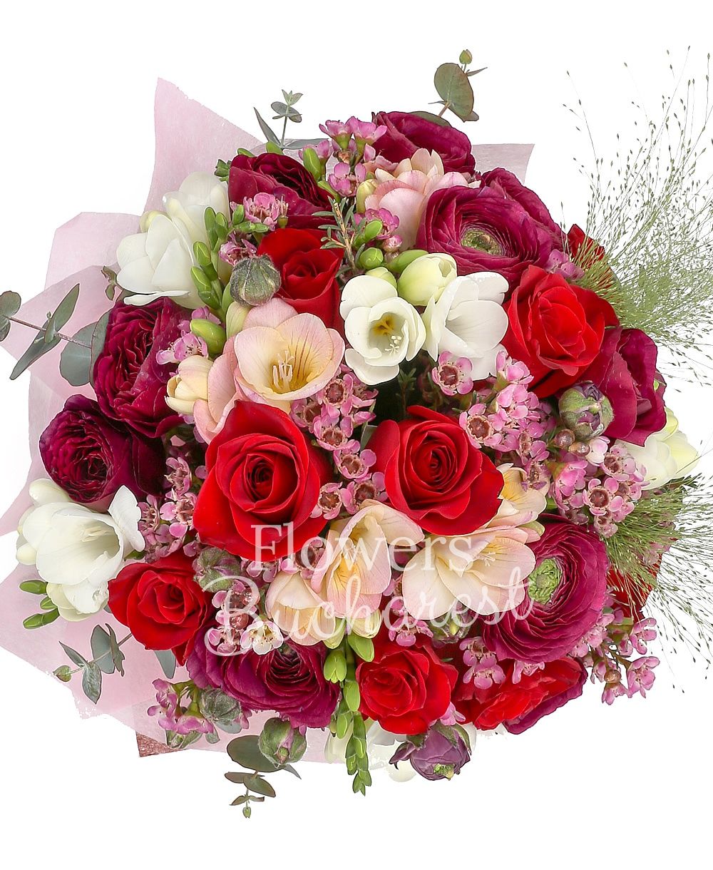 9 red roses, 10 garnet ranunculus, 10 white freesias, 5 waxflower, greenery