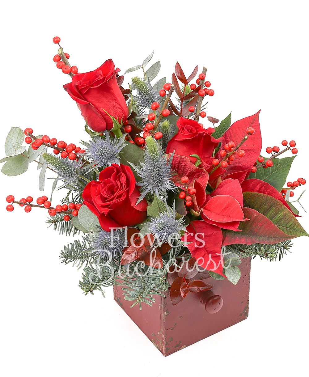 3 red roses, 3 white gerbera, poinsettia, 3 eryngium, ilex, greenery