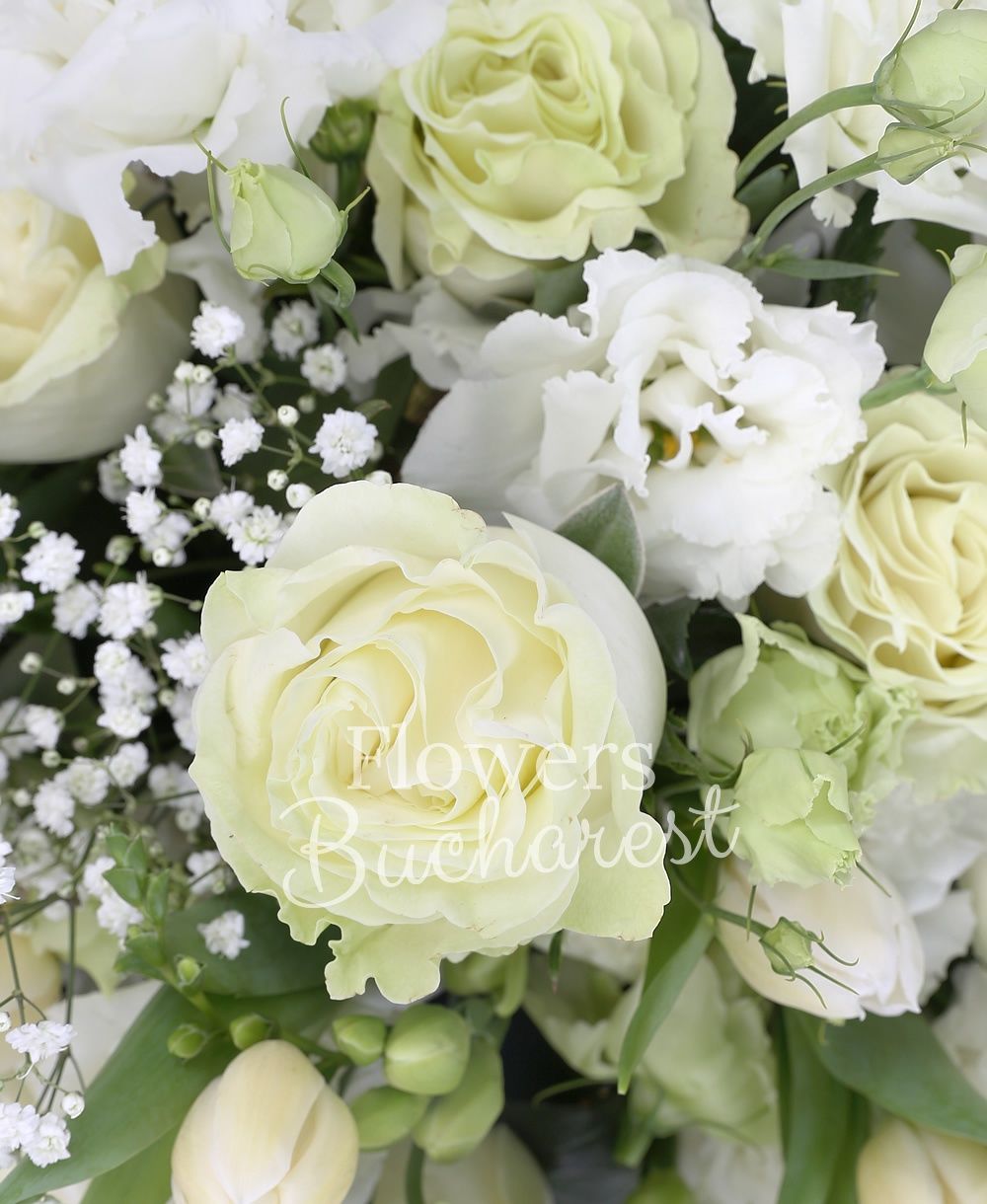 9 white roses, 5 white lisianthus, 10 white tulips, 10 white freesias, greenery