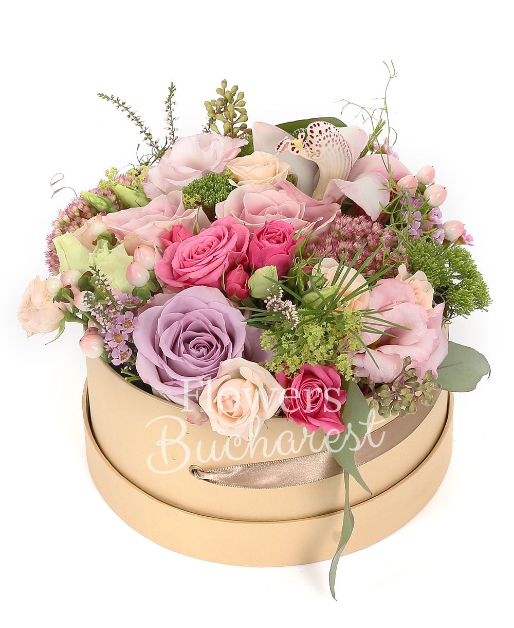 2 roses avalanche, 3 cyclam roses, 2 cream miniroses, 2 white orchids, carnations, 3 pink hypericum, white cymbidium, 2 cream roses, 1 waxflower, 3 veronica, greenery