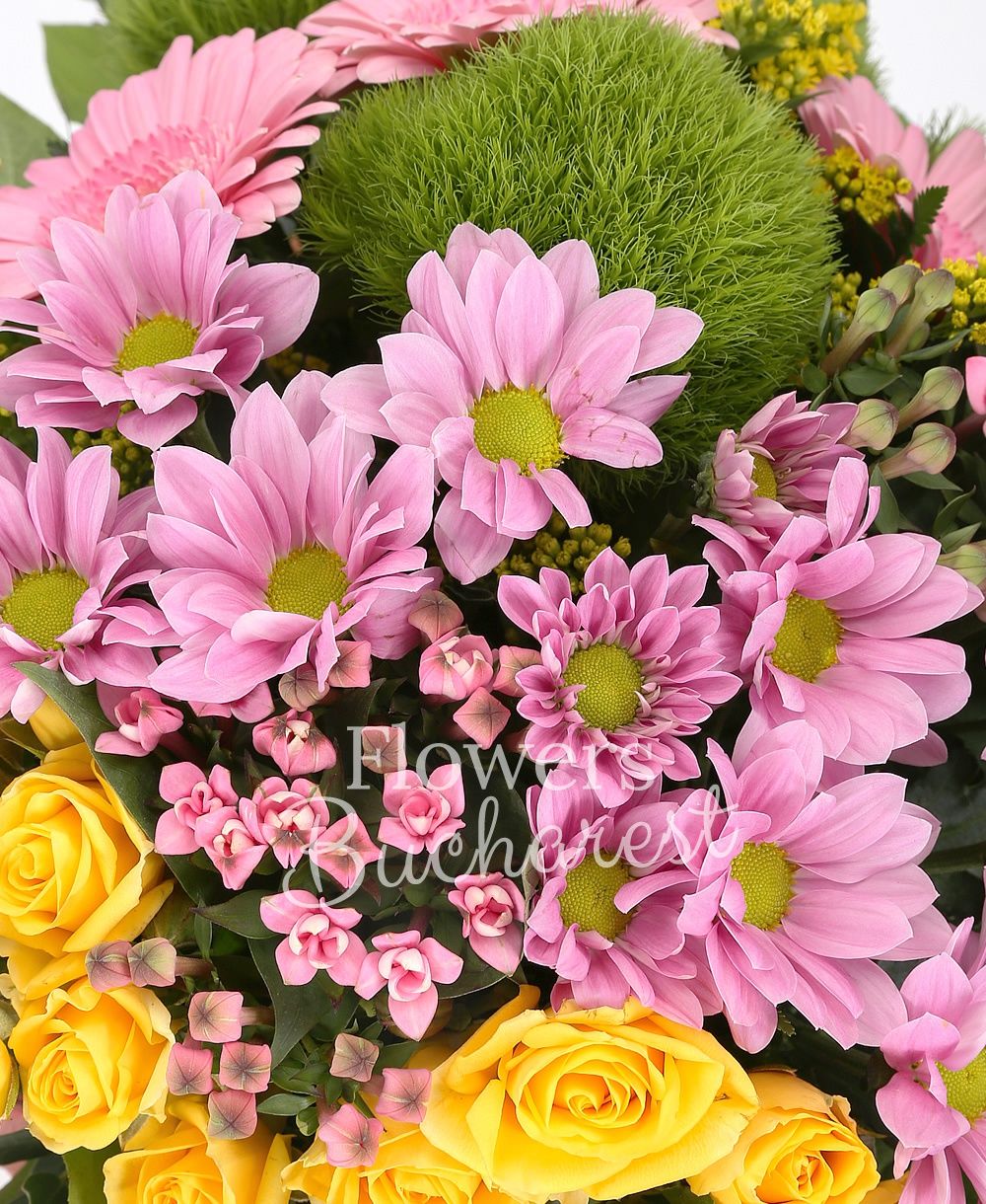 3 green carnations, 3 yellow miniroses, 2 pink chrysanthemums, 2 pink bouvardia, 3 pink gerberas, 3 solidago, greenery