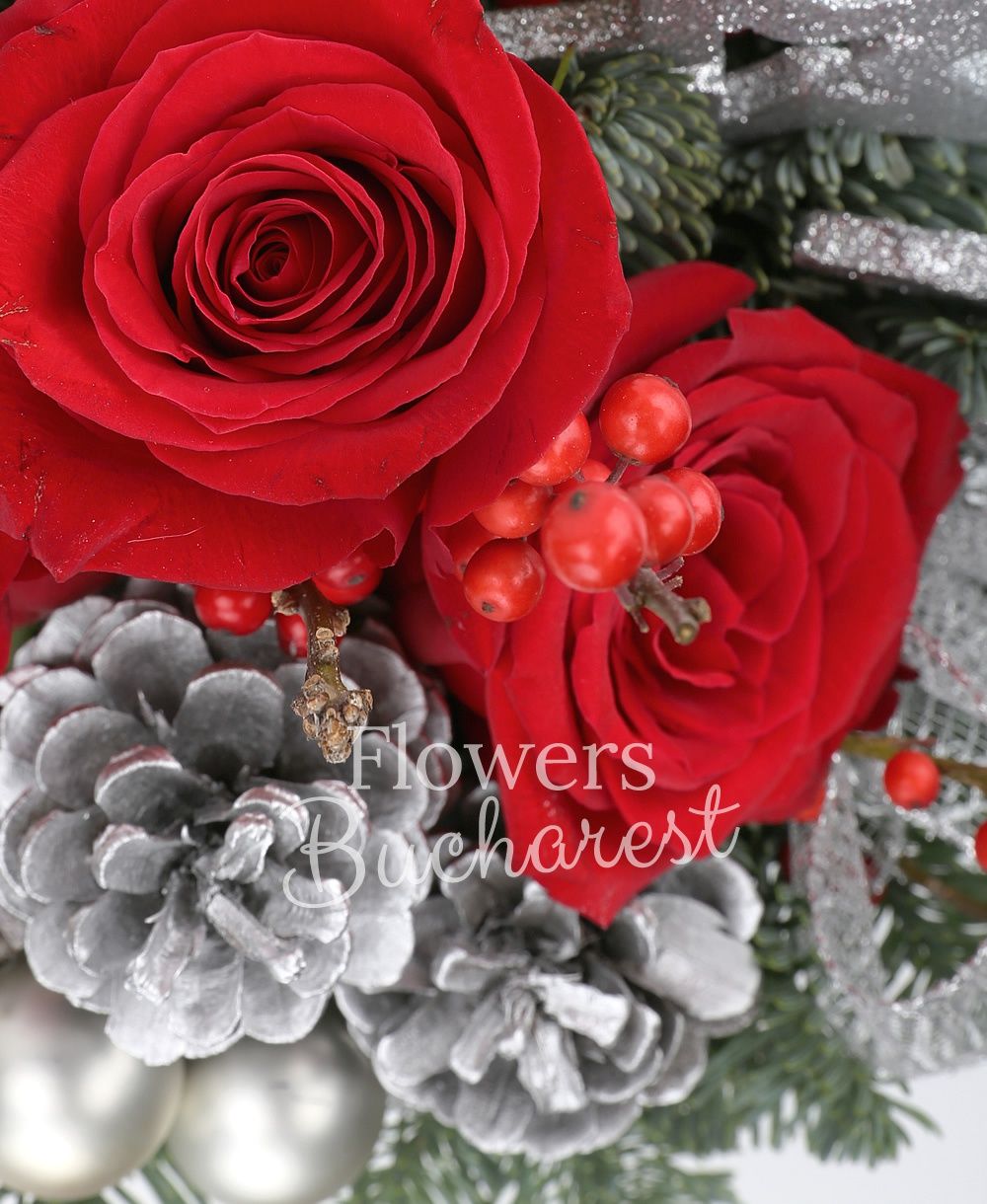 3 red roses, 2 red anthurium, globes, stars, sliced lemon slices, fir tree, greenery