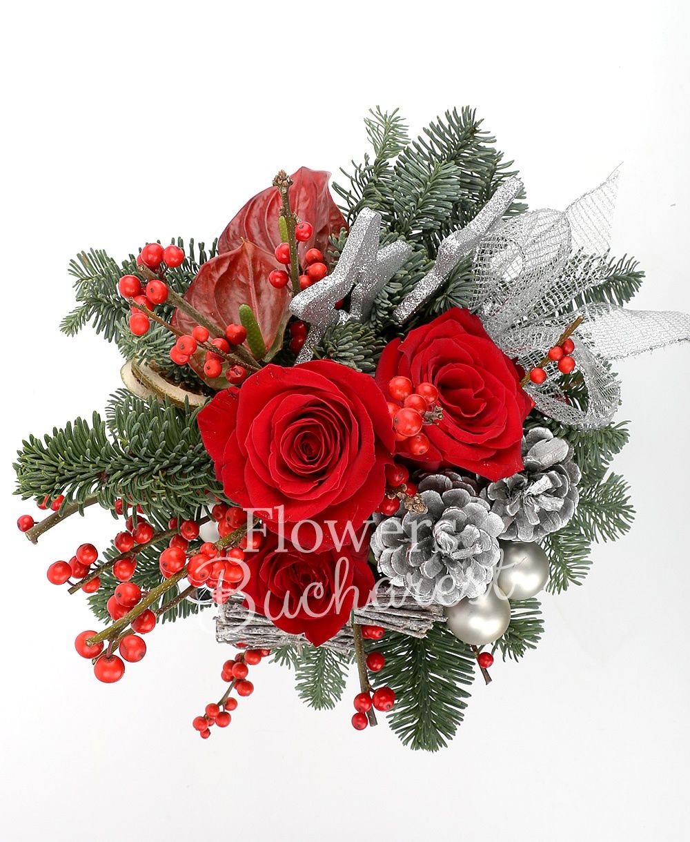 3 red roses, 2 red anthurium, globes, stars, sliced lemon slices, fir tree, greenery