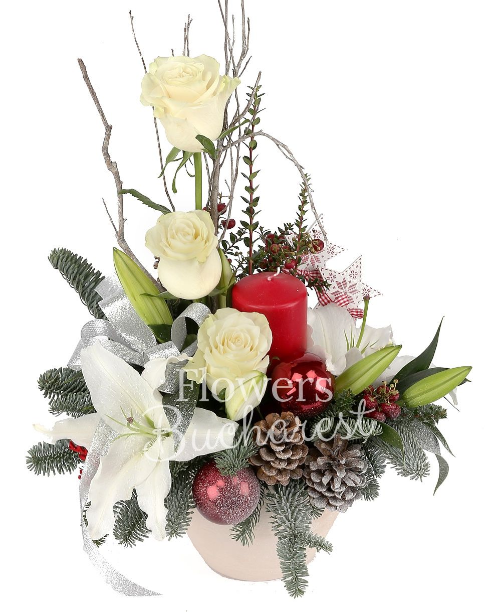 1 white lily, 3 white roses, 2 red hypericum, cones, globes, candle, greenery