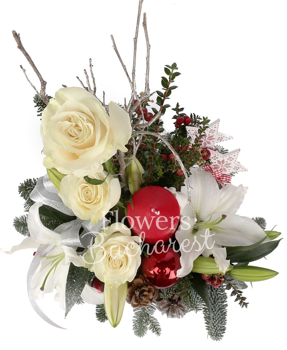 1 white lily, 3 white roses, 2 red hypericum, cones, globes, candle, greenery