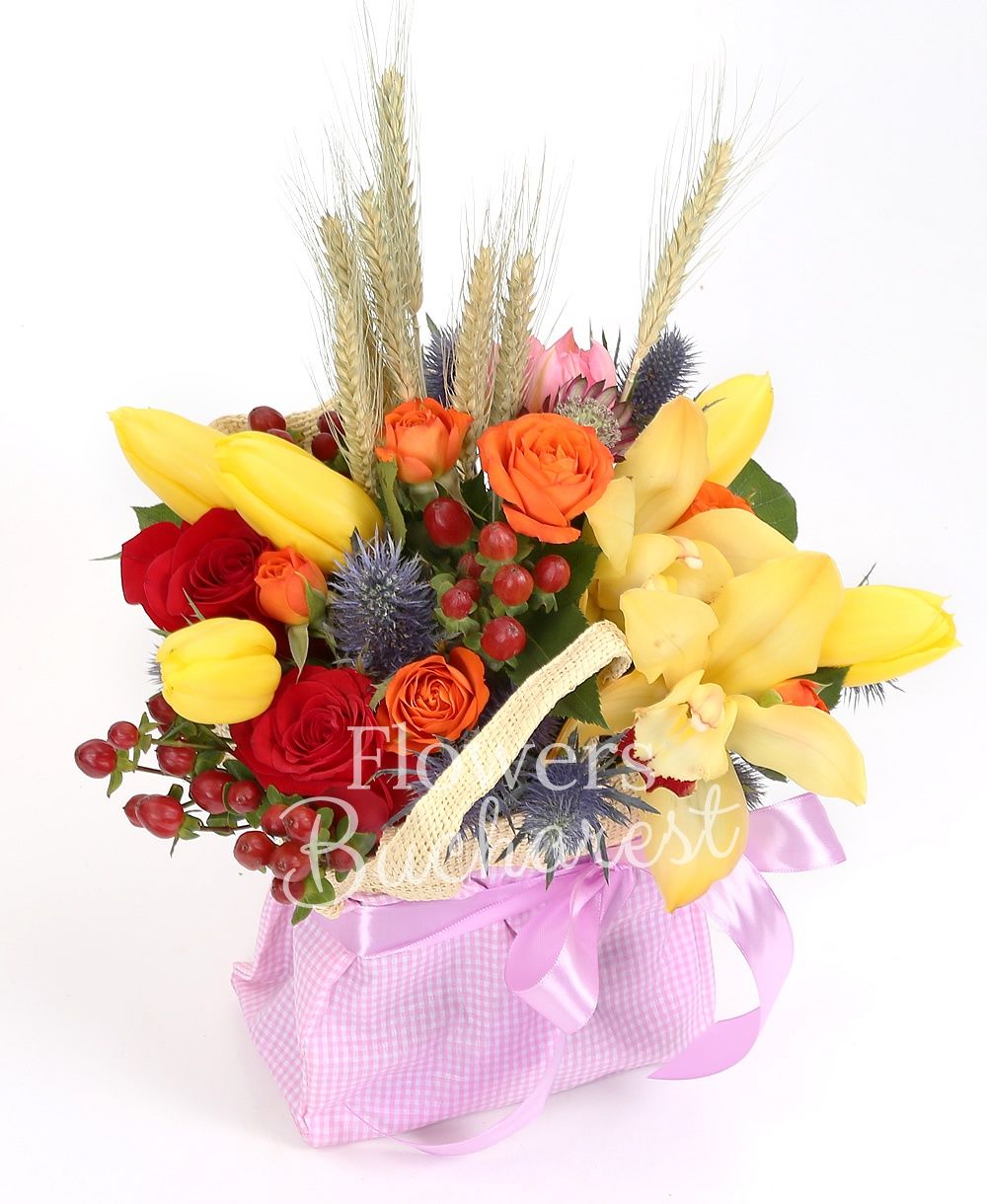 5 yellow tulips, 3 red roses, 2 orange miniroses, eryngium, yellow cymbidium