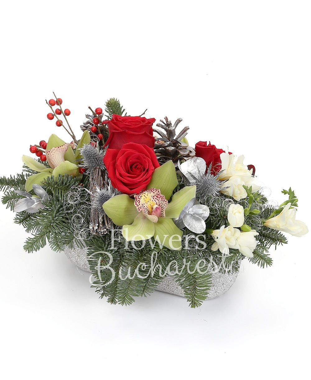 3 red roses, 5 freesias, green cymbidium, ilex, silver fir, eryngium, greenery, christmas decorations, ceramic vase