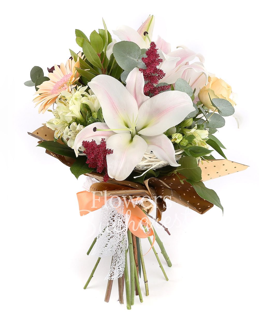 1 pink lily, 3 banana coloured roses, 2 cream gerbera, white alstroemeria, 3 mauve cala, 2 astilbe, greenery