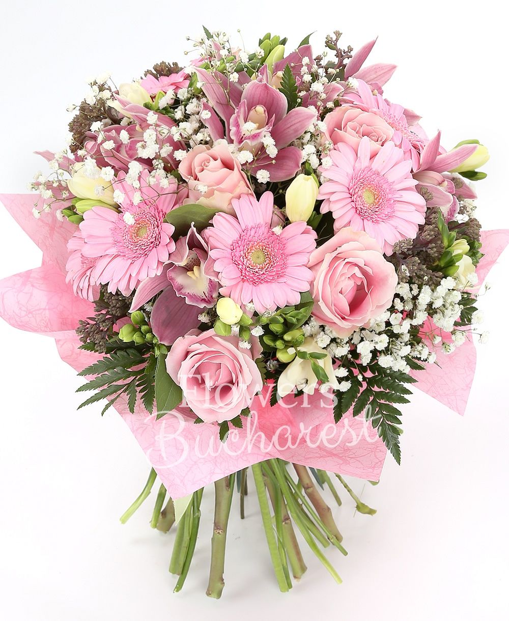 7 pink roses, 5 sedum, 10 white freesias, pink cymbidium, 5 gerbera, greenery